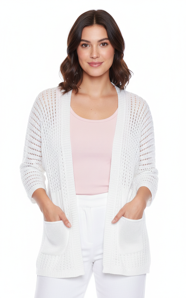 Woman wearing a white open-knit cardigan over a pink top on a white background