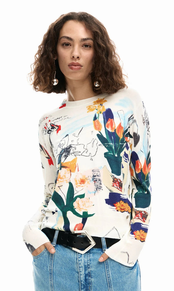 Abstract floral art print lightweight long sleeve knit sweater with crew neckline and ribbed trim styled with denim.