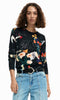 Abstract floral art print lightweight long sleeve knit sweater with crew neckline and ribbed trim styled with denim.