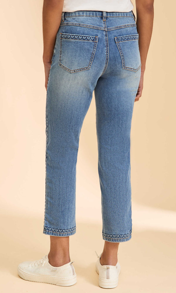Medium wash cropped straight-leg jeans with embroidered heart trim