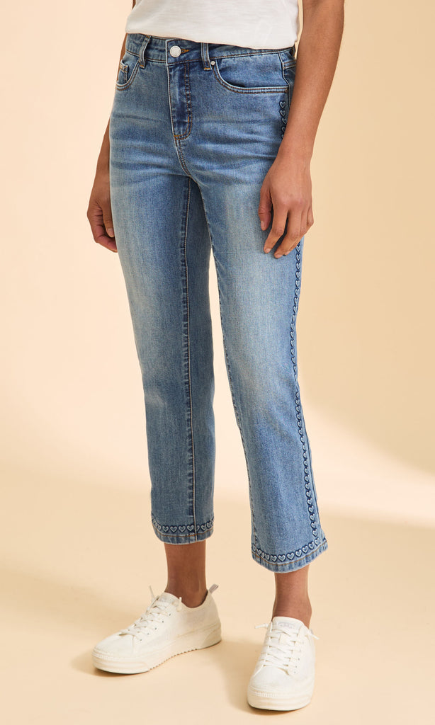 Medium wash cropped straight-leg jeans with embroidered heart trim