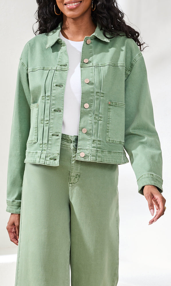 Cropped denim jacket with button front and front patch pockets styled with coordinating pants.