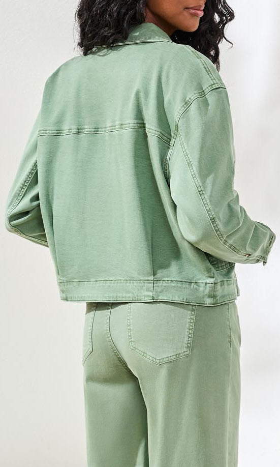 Cropped denim jacket with button front and front patch pockets styled with coordinating pants.