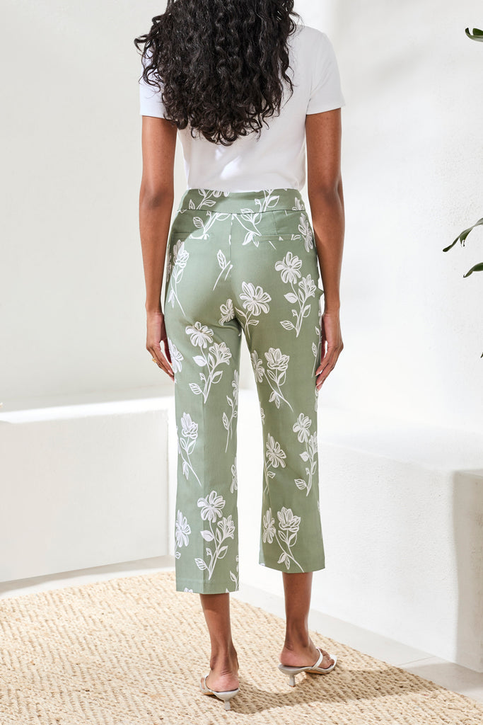 Floral print cropped straight leg high rise pull-on ankle pants with streamlined silhouette.