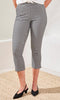 Person wearing black and white checkered pants on a neutral background