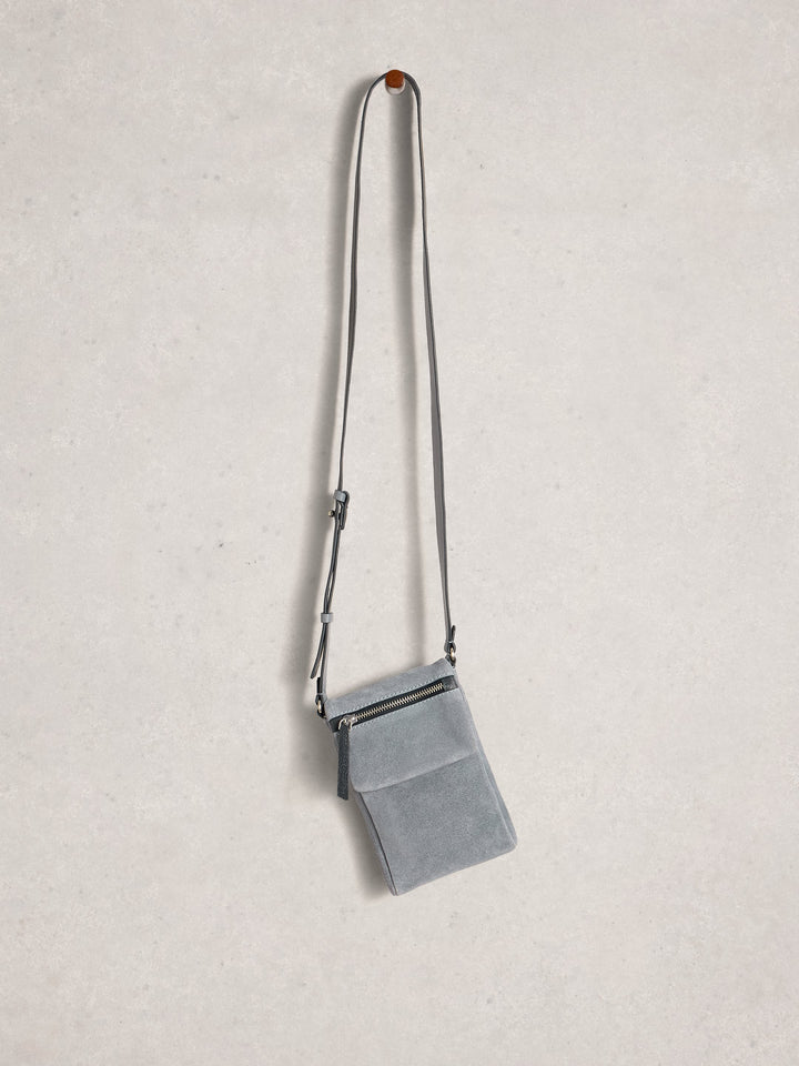 Gray crossbody bag on a light gray background
