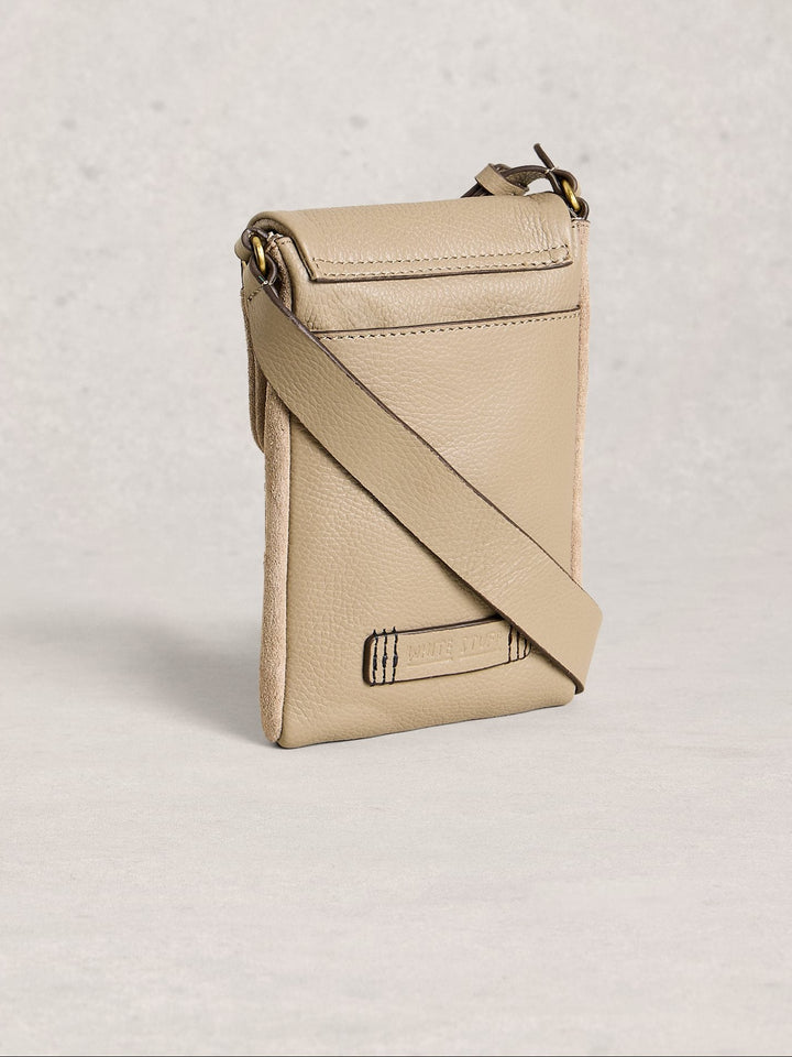 Beige crossbody bag on a light gray background