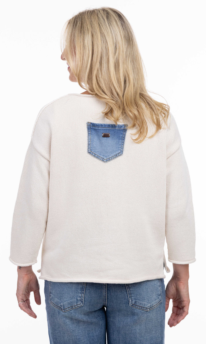 Cream knit sweater with embroidered denim patch pockets