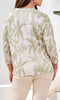 Tropical botanical print 3/4 sleeve lightweight knit top with crew neckline and side slits.