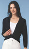 Woman wearing a black cardigan over a white top against a blue background