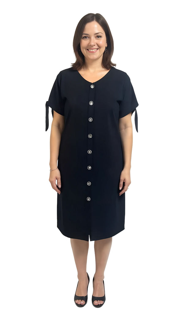 Woman wearing a black dress with buttons on a white background