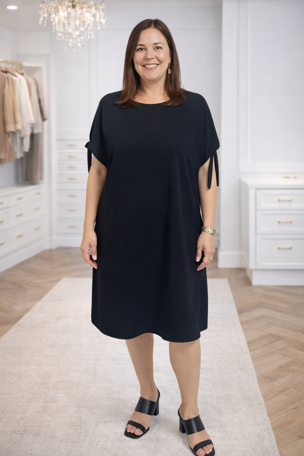 Woman wearing a black dress in a clothing store