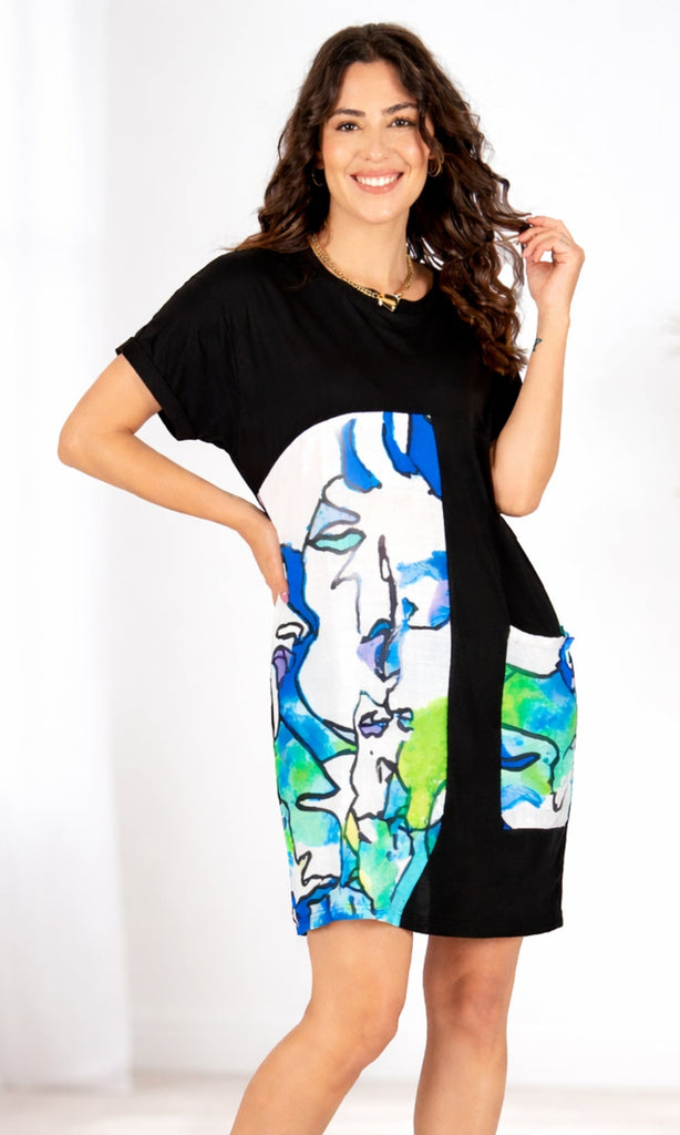 Woman wearing a black dress with colorful abstract patterns on a white background