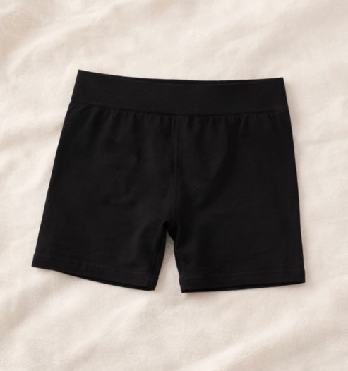 Black shorts on a light beige background