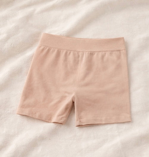 Beige shorts on a light beige background