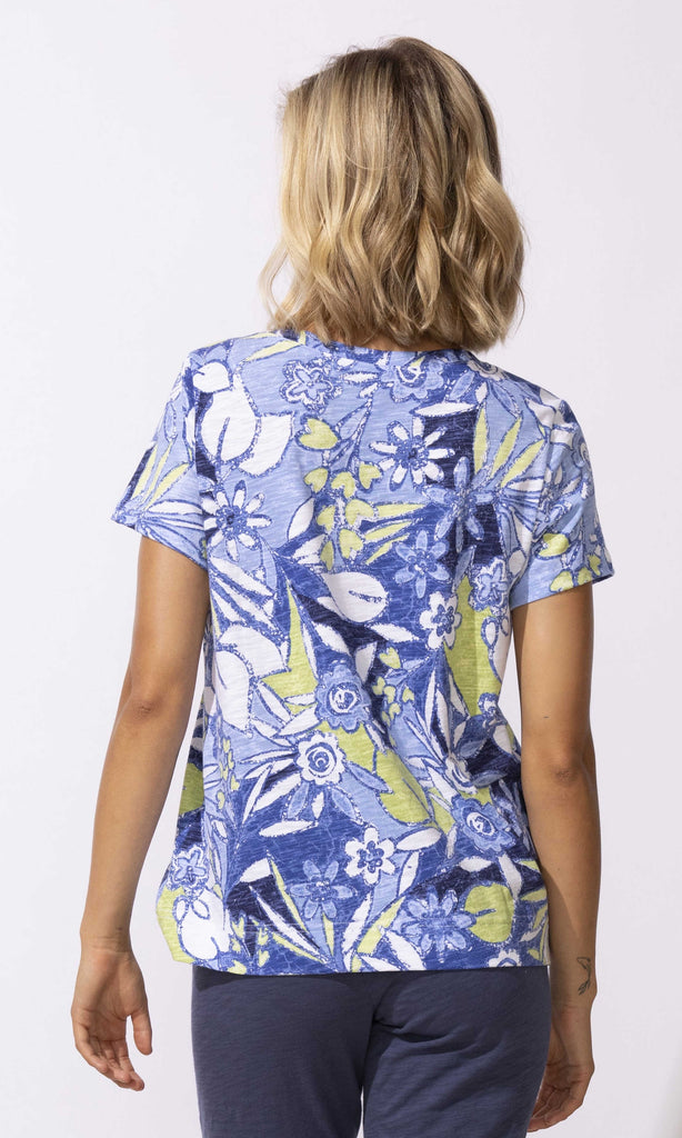 Tropical floral V-neck short sleeve top with relaxed fit and lightweight fabric.