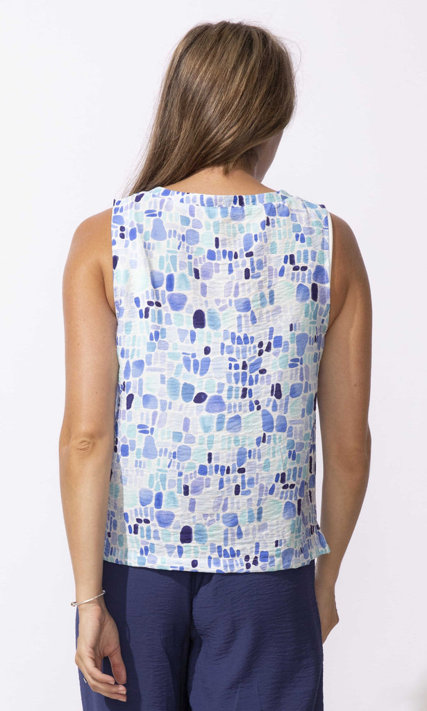 Abstract print sleeveless V-neck top with relaxed fit and lightweight fabric.