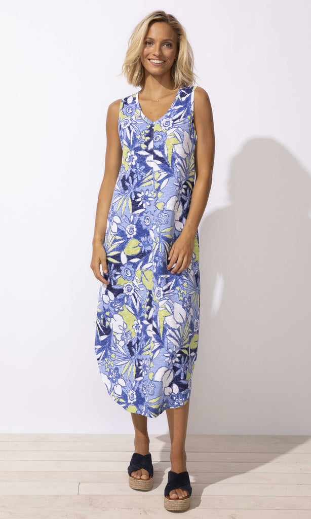tropical floral sleeveless midi dress with V-neck and curved hem, summer resort outfit.