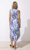 tropical floral sleeveless midi dress with V-neck and curved hem, summer resort outfit.