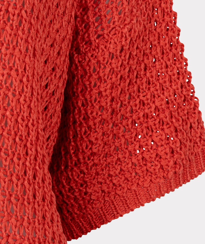 Close-up of a red textured fabric on a white background