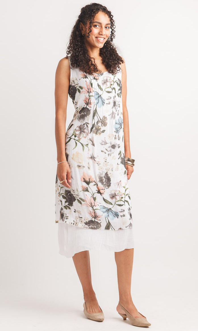 Woman wearing a floral dress on a white background
