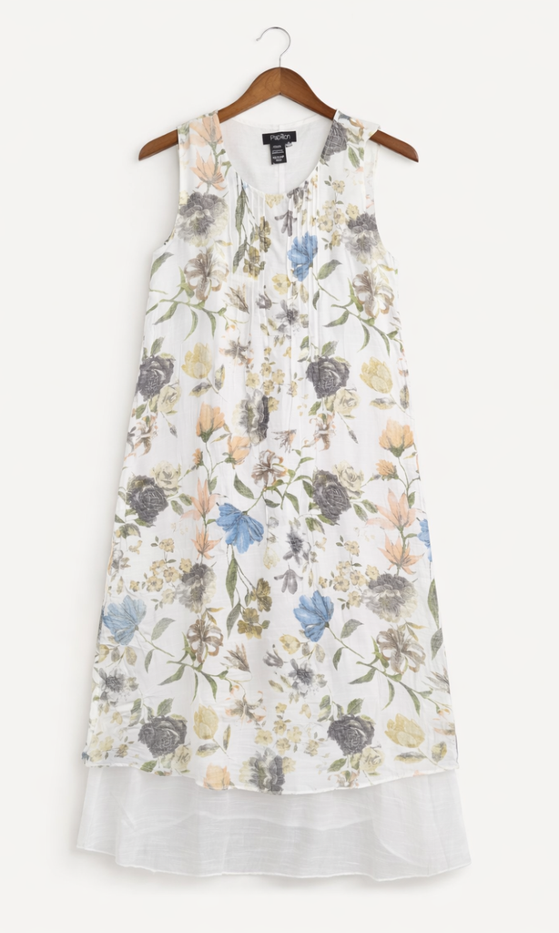Floral dress on a hanger against a white background