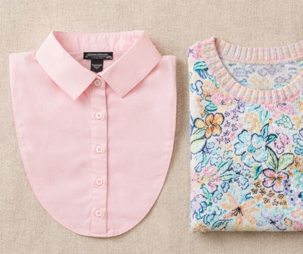 Pink shirt and floral patterned fabric on a beige background