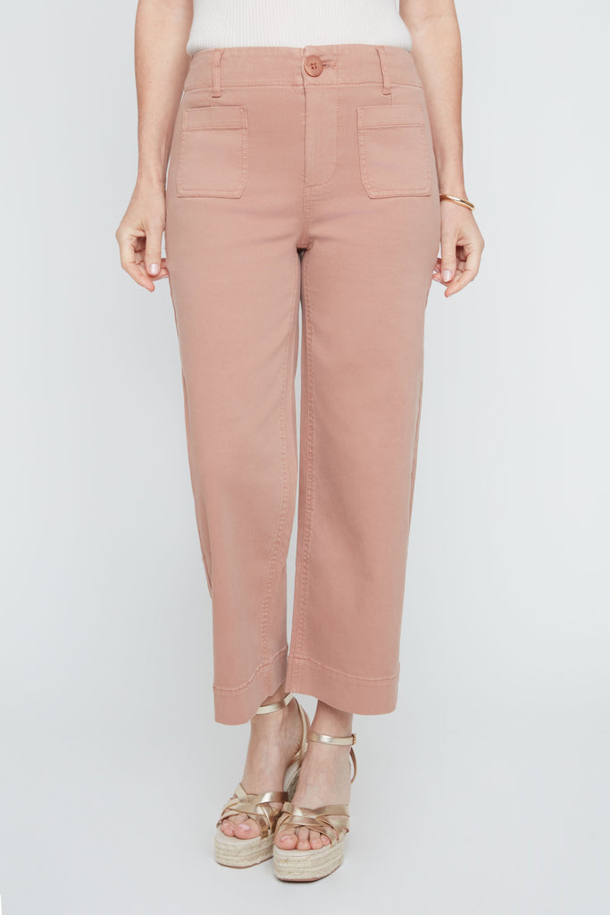 Person wearing pink pants on a white background