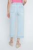 Light blue jeans worn by a person on a white background