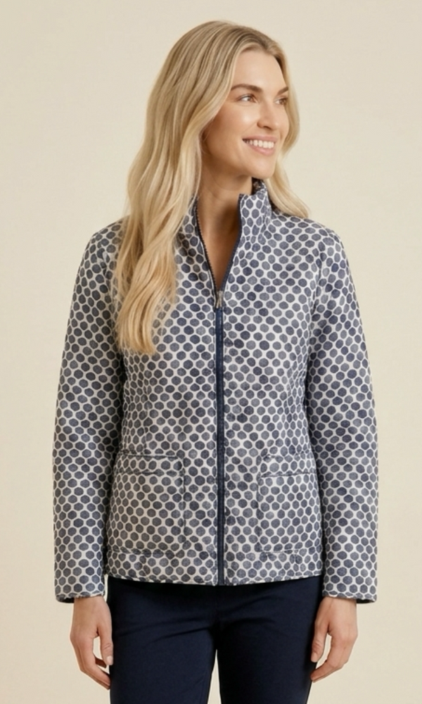 Woman wearing a patterned jacket on a beige background
