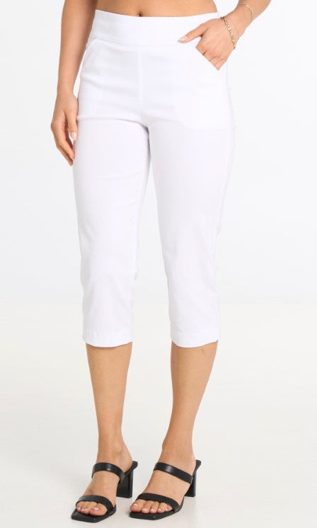 White capri pants worn by a person on a white background