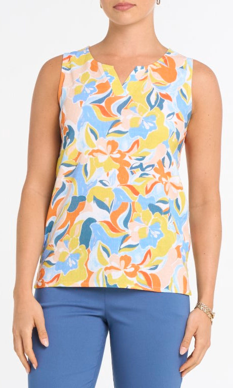 Woman wearing a colorful sleeveless top with abstract pattern on a white background