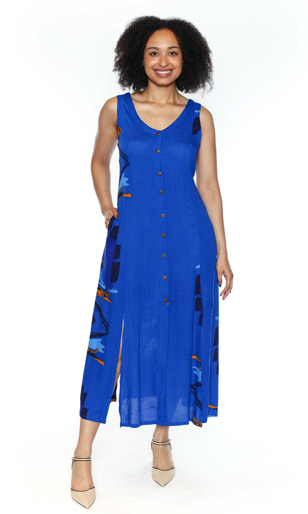 Woman wearing a blue sleeveless dress with a pattern on a white background