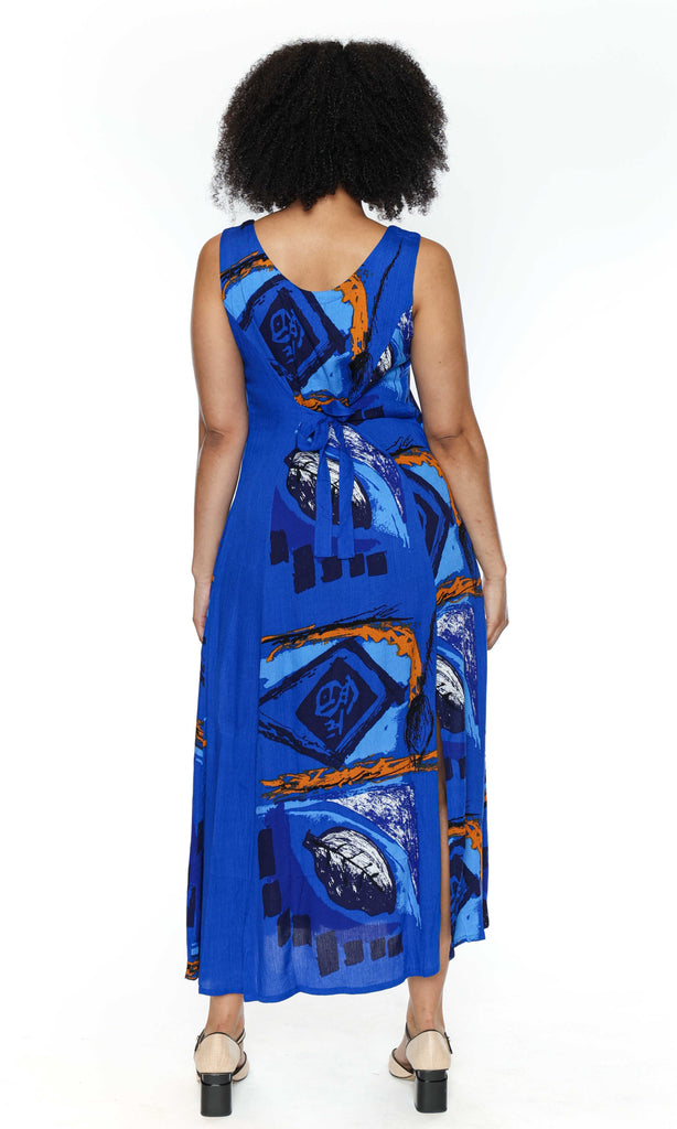 Back of woman wearing a blue patterned dress on a white background