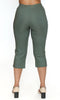 Green capri pants worn by a person on a white background