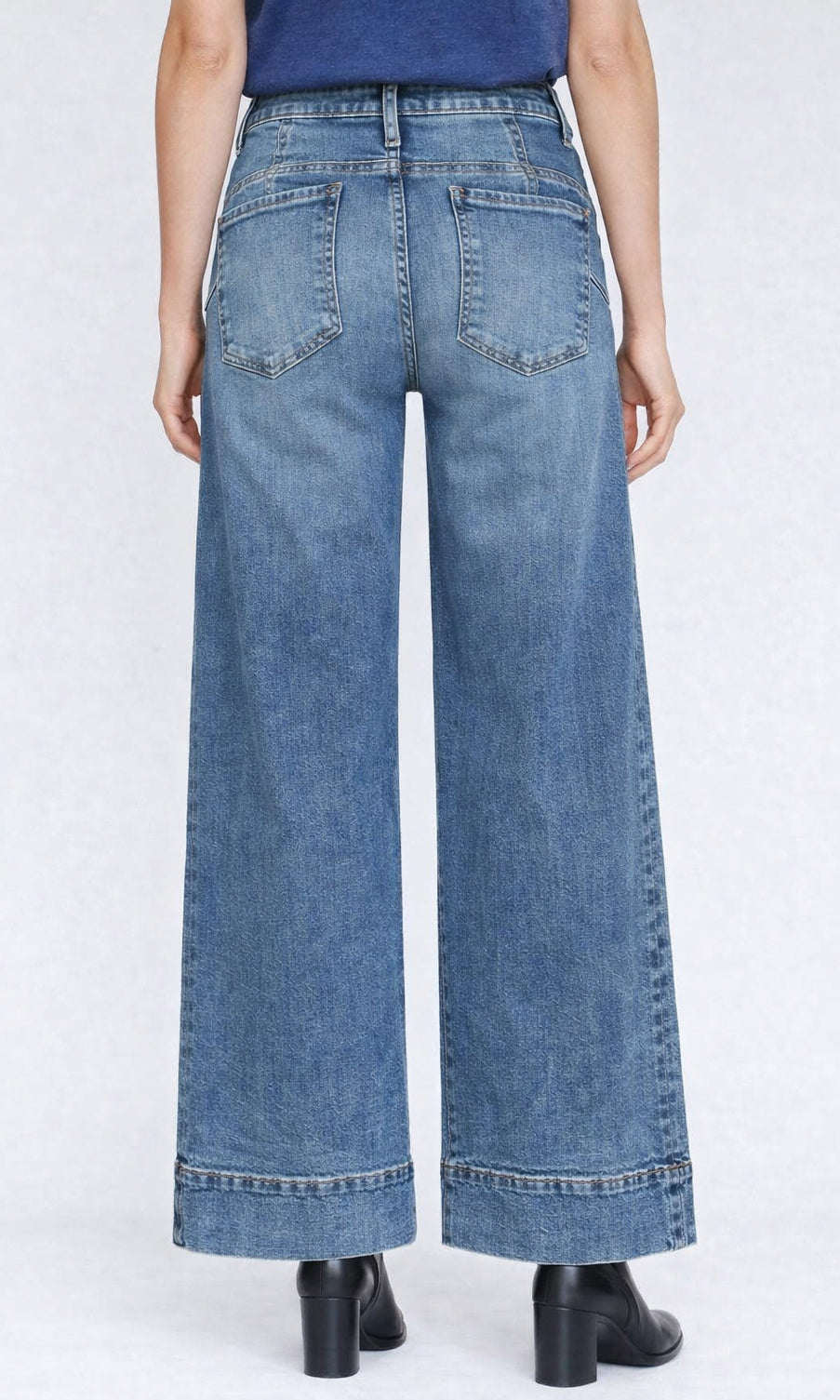 Wide-leg jeans worn by a person on a white background