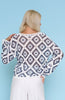 Model wearing lightweight crochet diamond pattern knit sweater with long sleeves and crew neckline