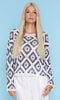 Model wearing lightweight crochet diamond pattern knit sweater with long sleeves and crew neckline