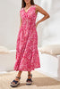 Woman wearing a pink floral dress in a bedroom setting