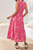 Person wearing a red floral dress in a minimal indoor setting